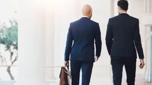 A California business litigation attorney and his client walk into a courthouse.